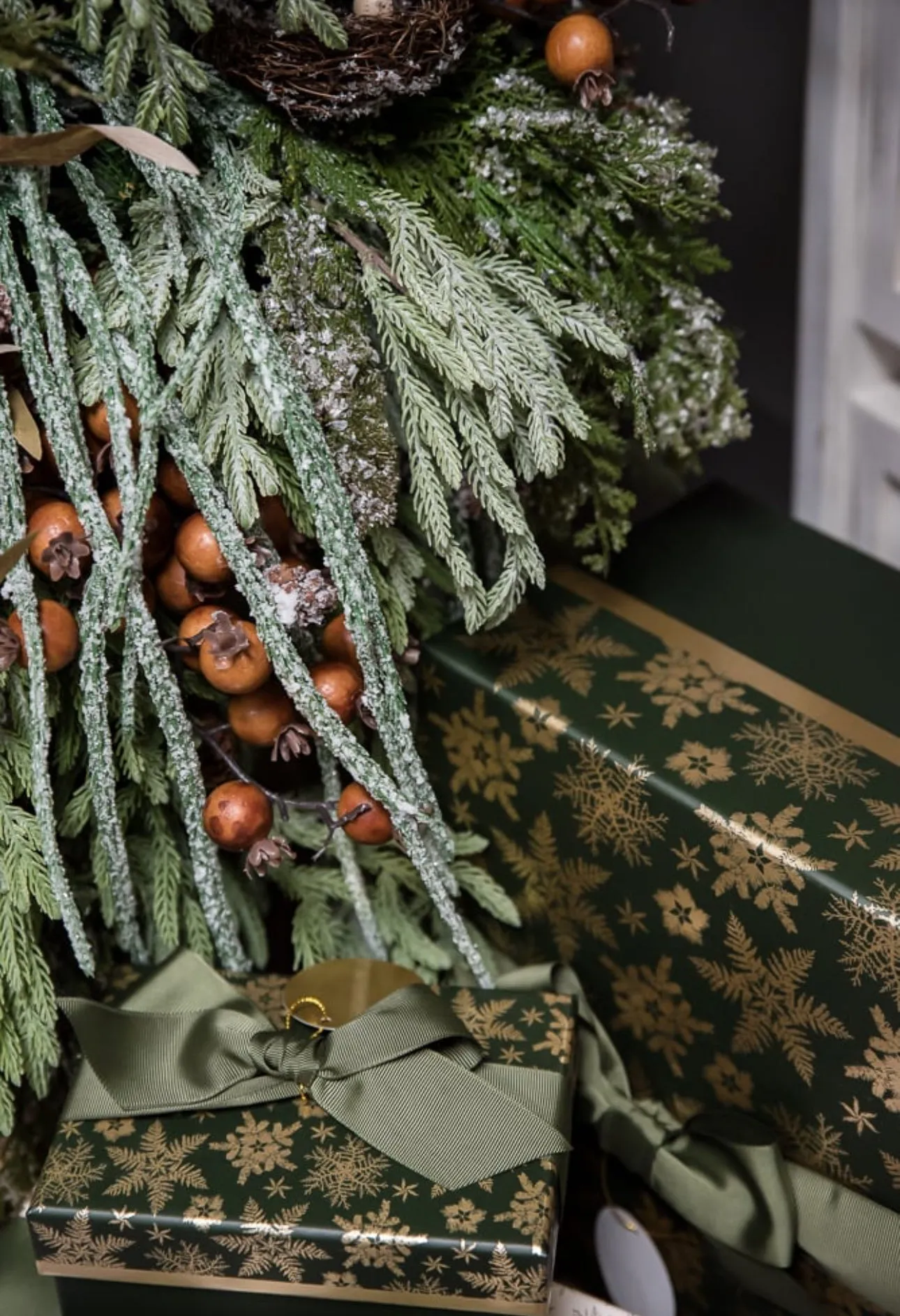 Artificial, frosted, weeping greenery branch