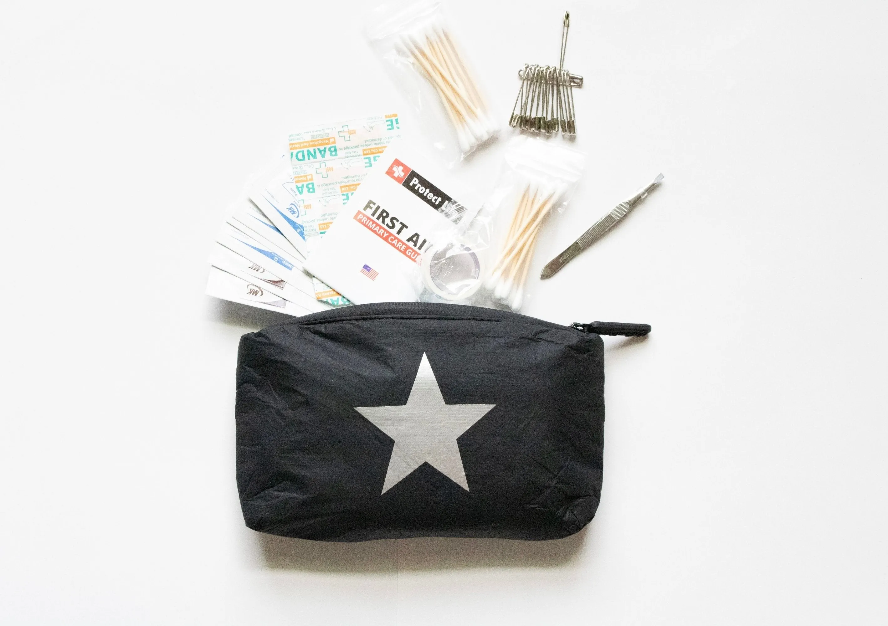 Mini Padded Zipper Pack in Black with Silver Star